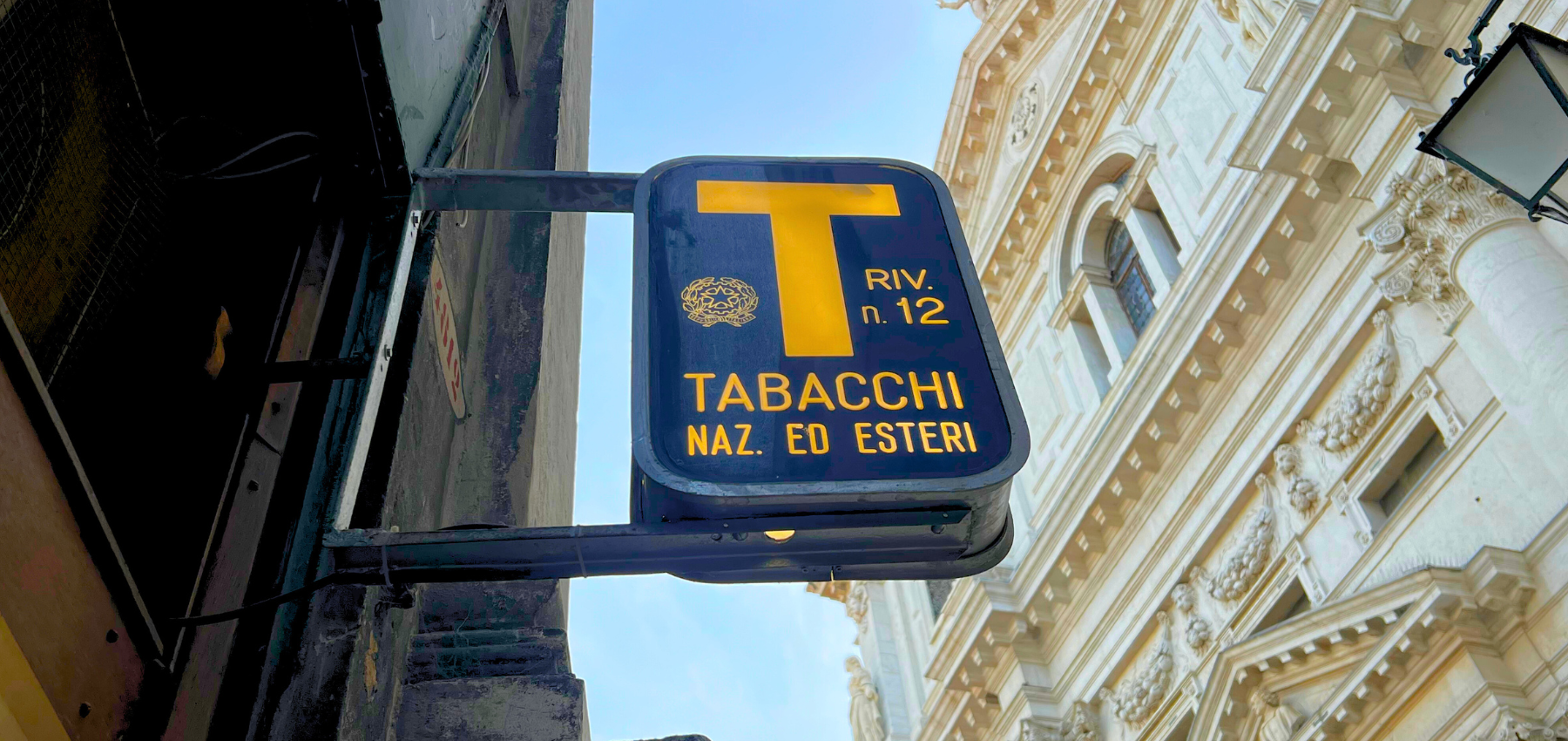 An Italian tabaccheria (tobacco shop) — where you buy bus tickets, stamps, SIM cards, and pay bills, making it one of the most essential shops for daily life